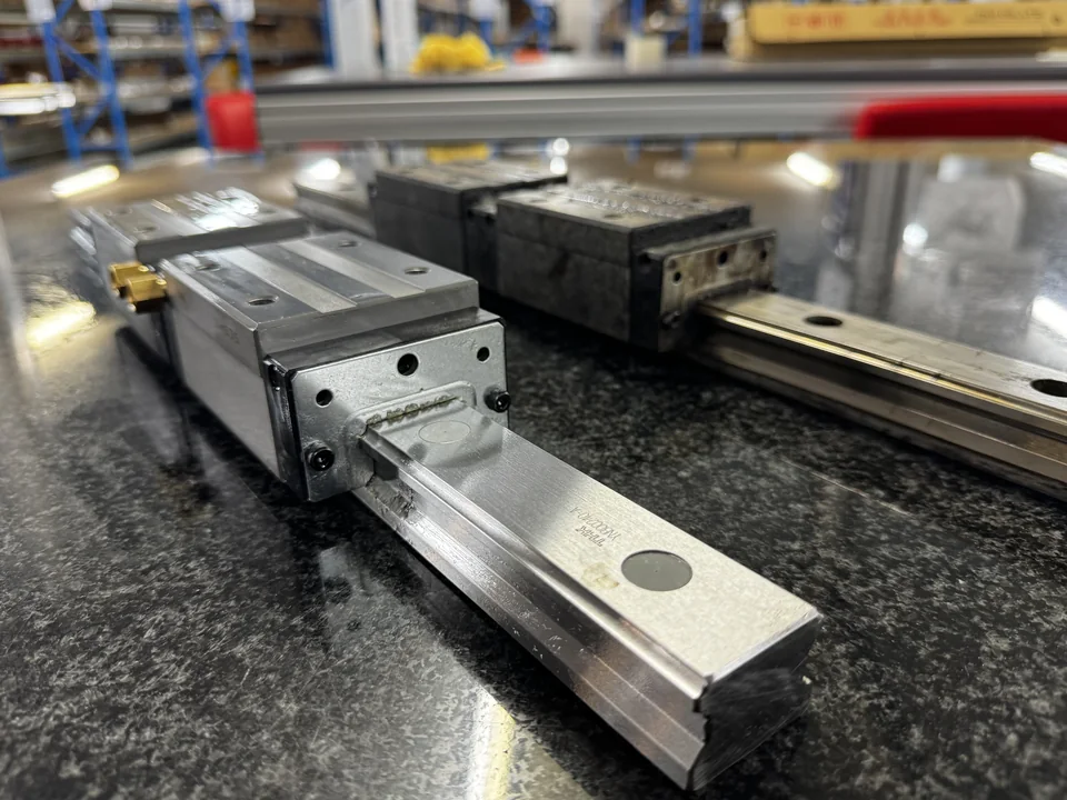 Replacement linear guide and carriage alongside the existing component